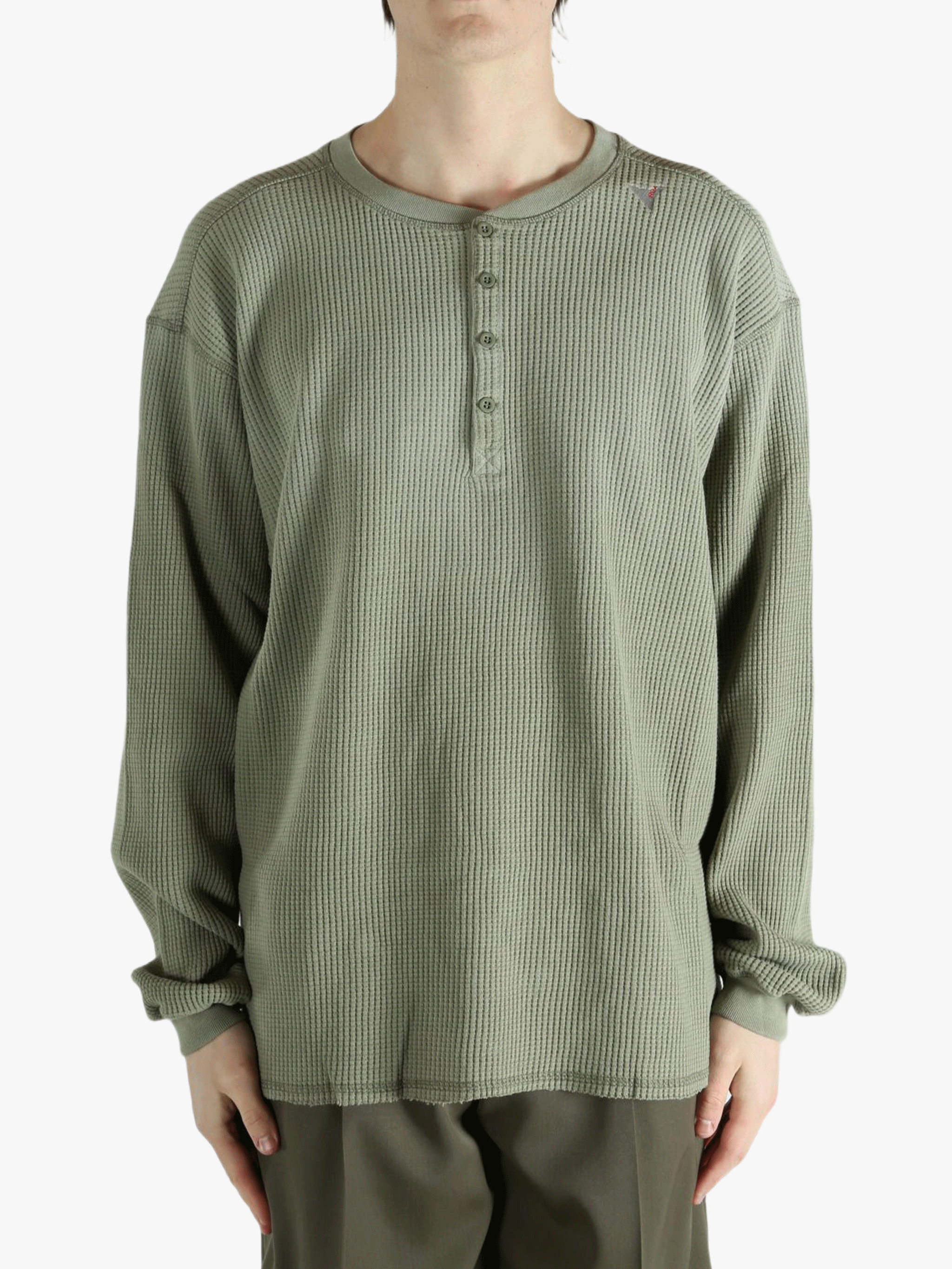 Grey t-shirt worn by a person, showing the shirt's fit