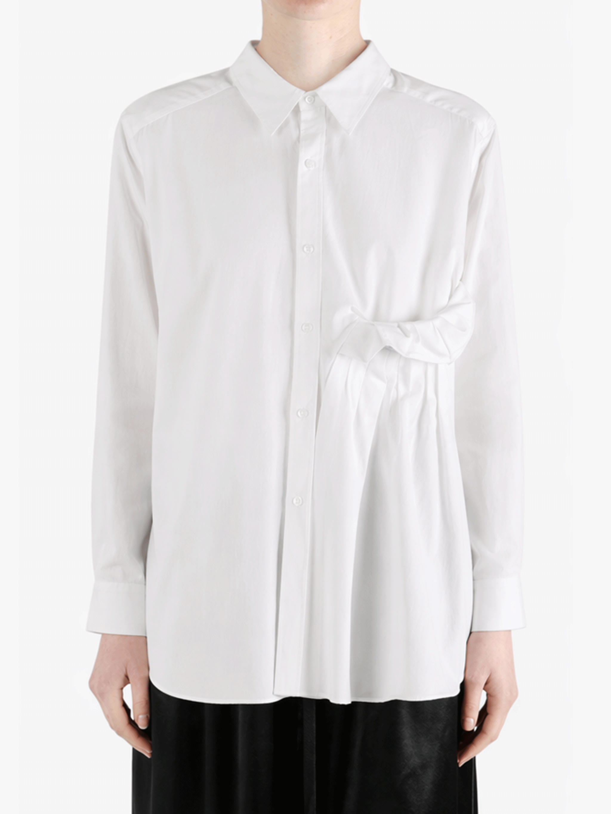 White shirt worn by a person, showing the shirt fit