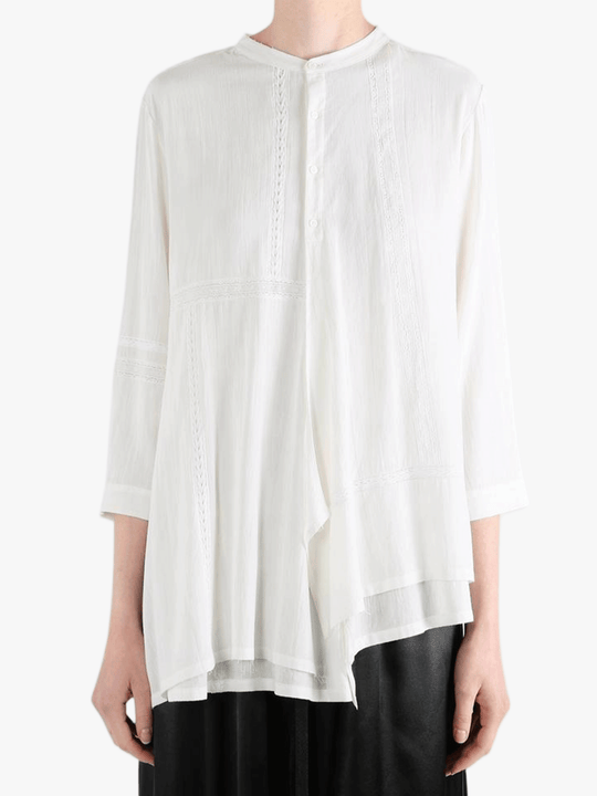 White shirt worn by a person, showing the shirt fit