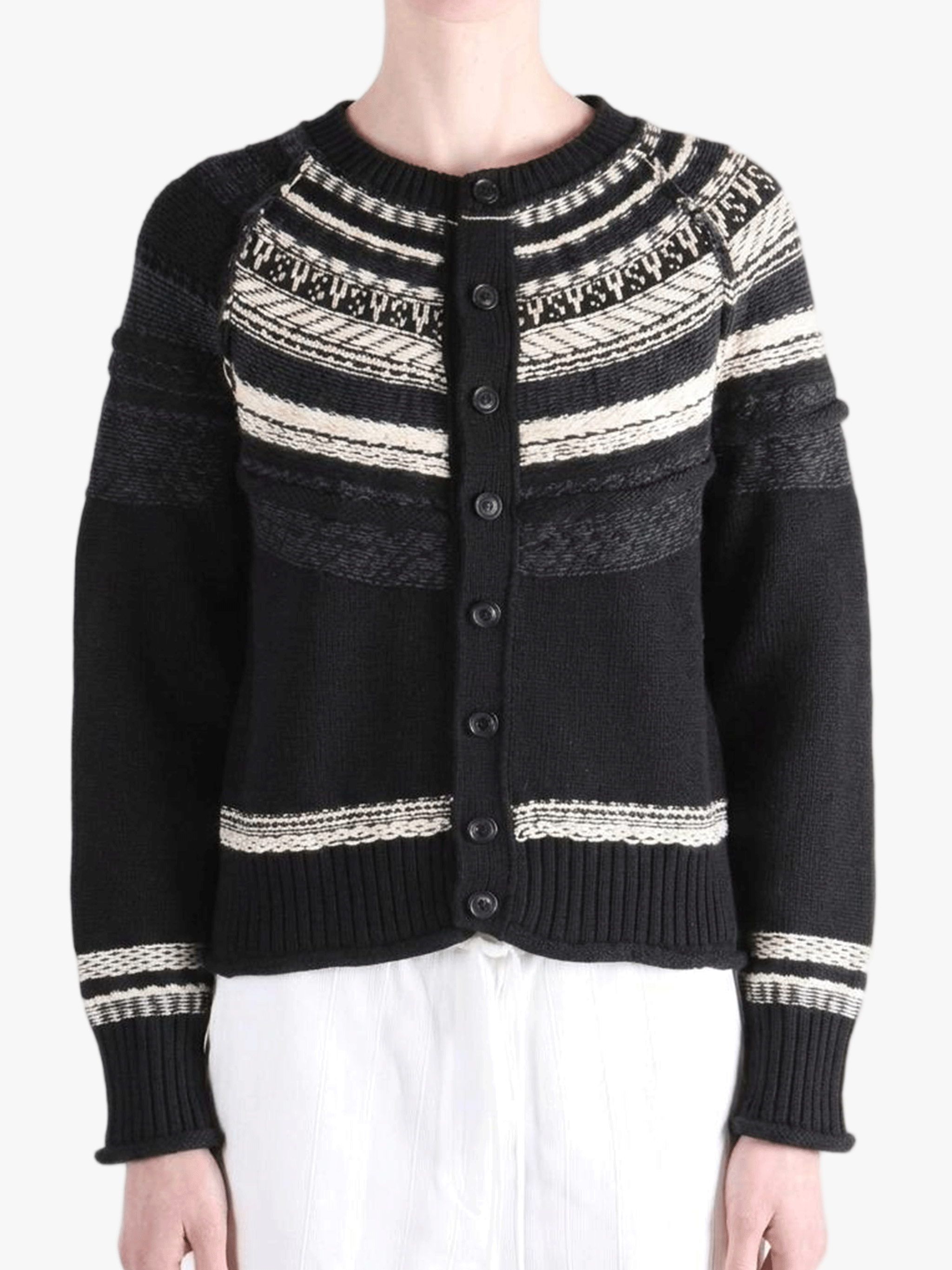 Black knitwear worn by a person, showing the knitwear fit