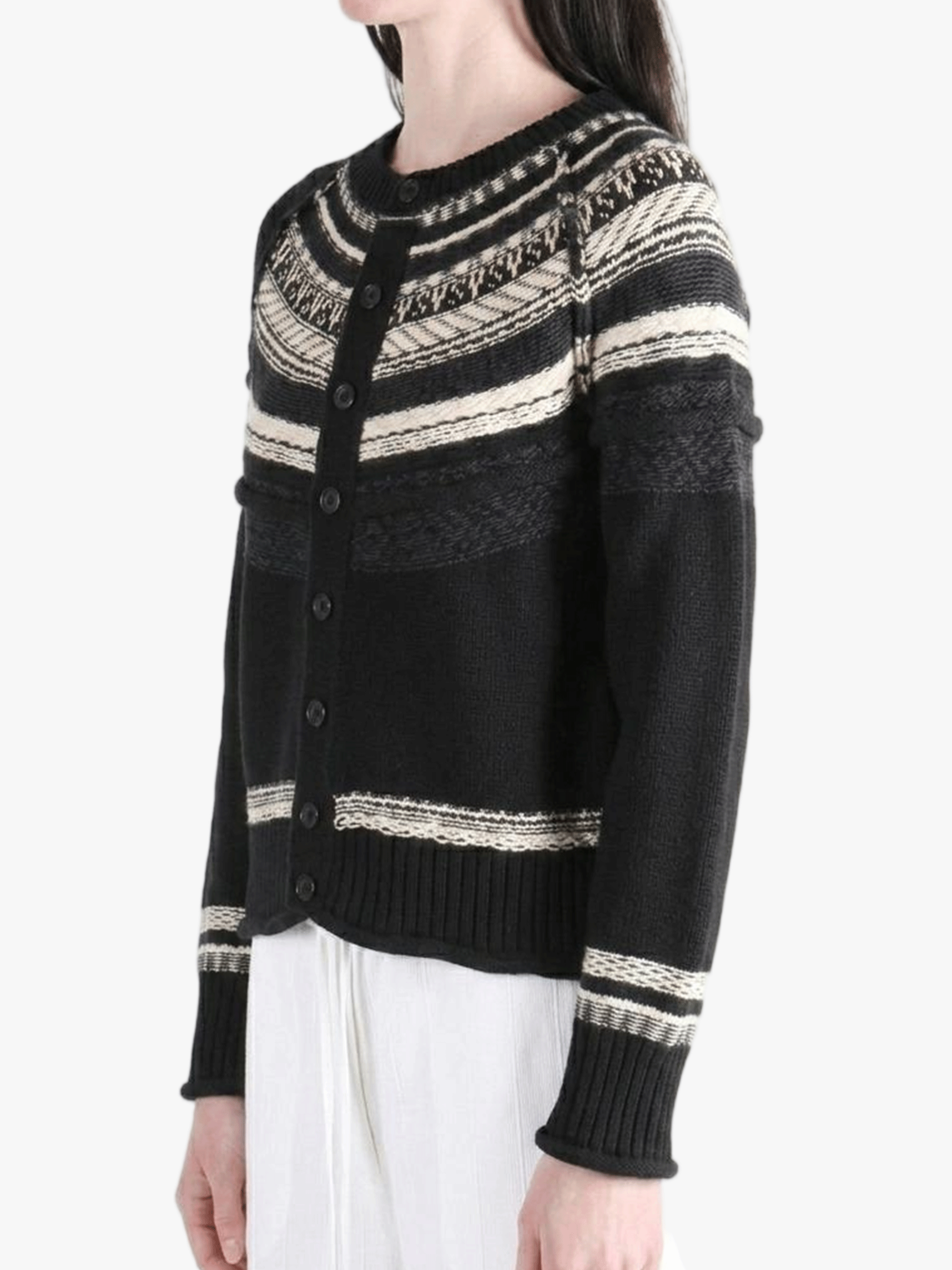 Black knitwear worn by a person, showing the knitwear fit
