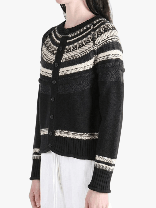 Black knitwear worn by a person, showing the knitwear fit