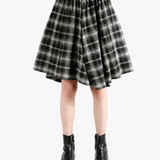 Black pants worn by a person, showing the pants fit