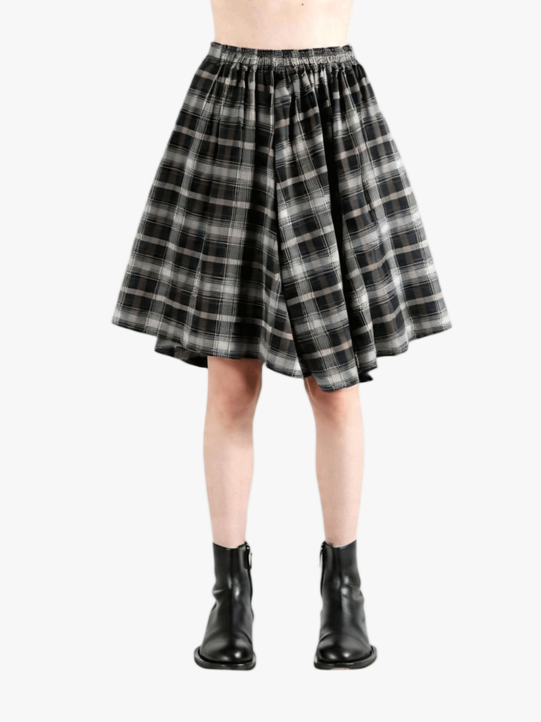 Black pants worn by a person, showing the pants fit