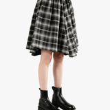 Black pants worn by a person, side view