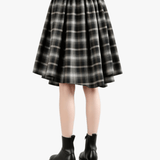 Black pants worn by a person, back view