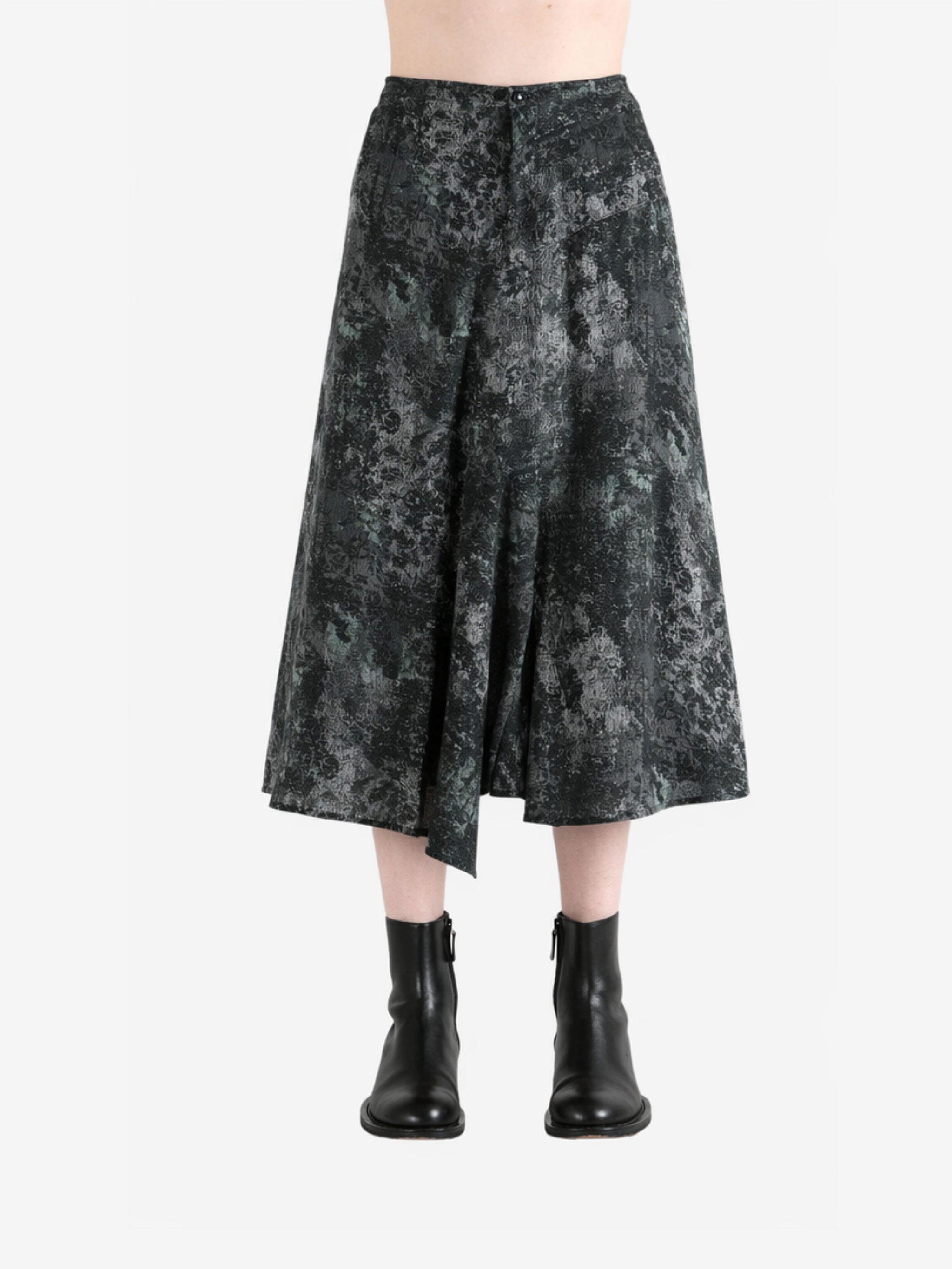 Green pants worn by a person, showing the pants fit