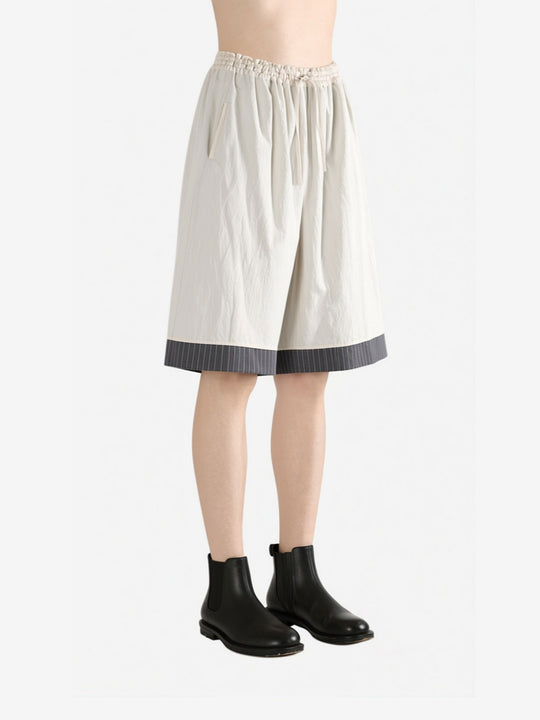 White pants worn by a person, side view