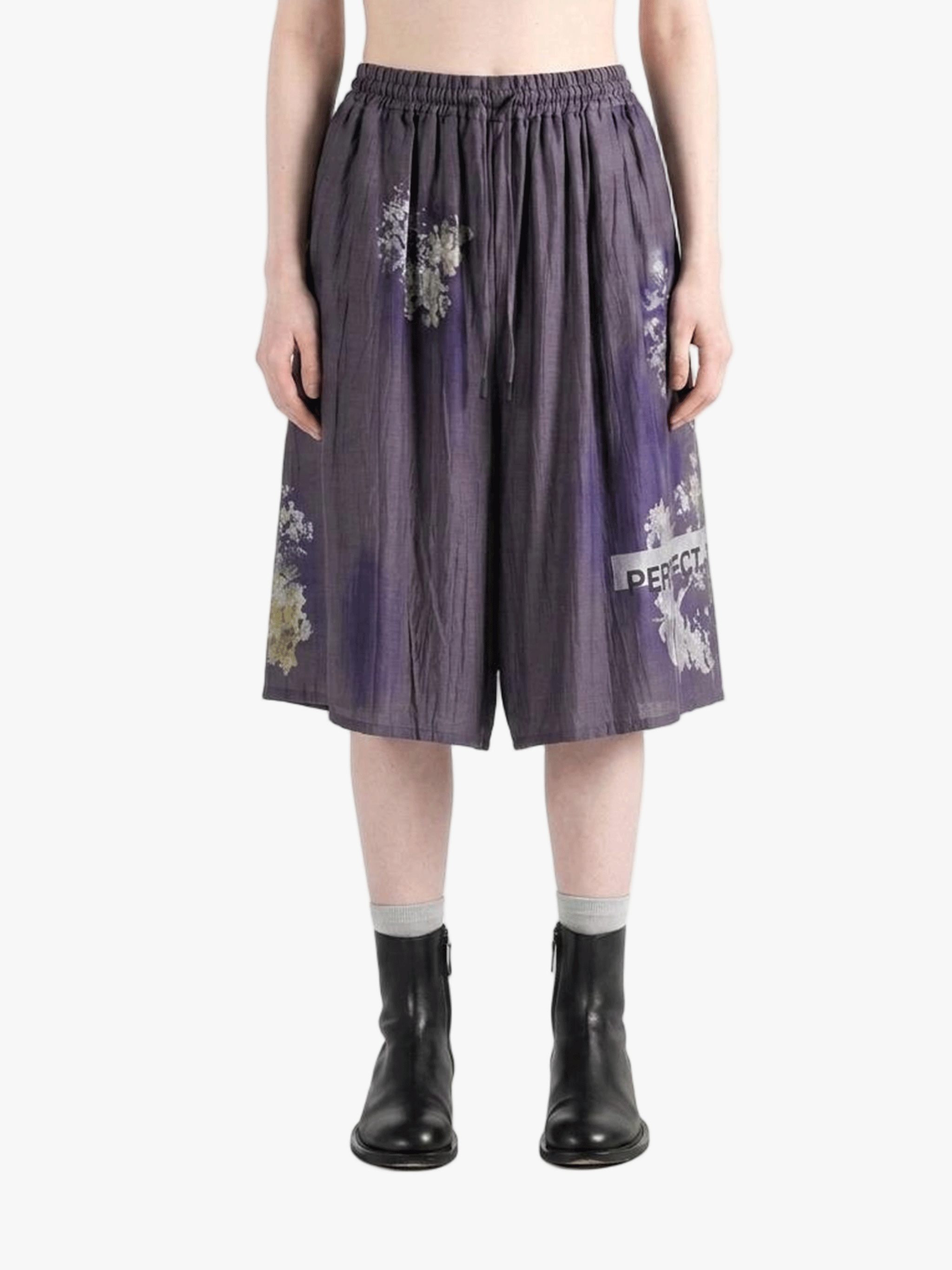 Purple shorts worn by a person, showing the shorts fit