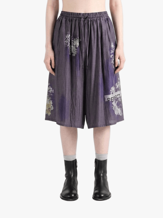 Purple shorts worn by a person, showing the shorts fit