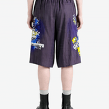 Purple shorts worn by a person, back view