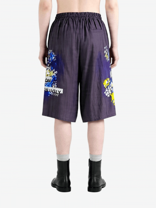 Purple shorts worn by a person, back view