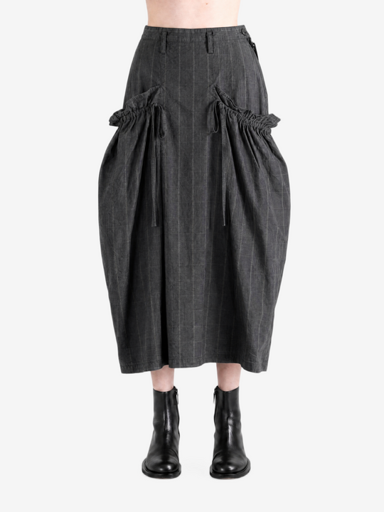 Grey skirt worn by a person, showing the skirt fit