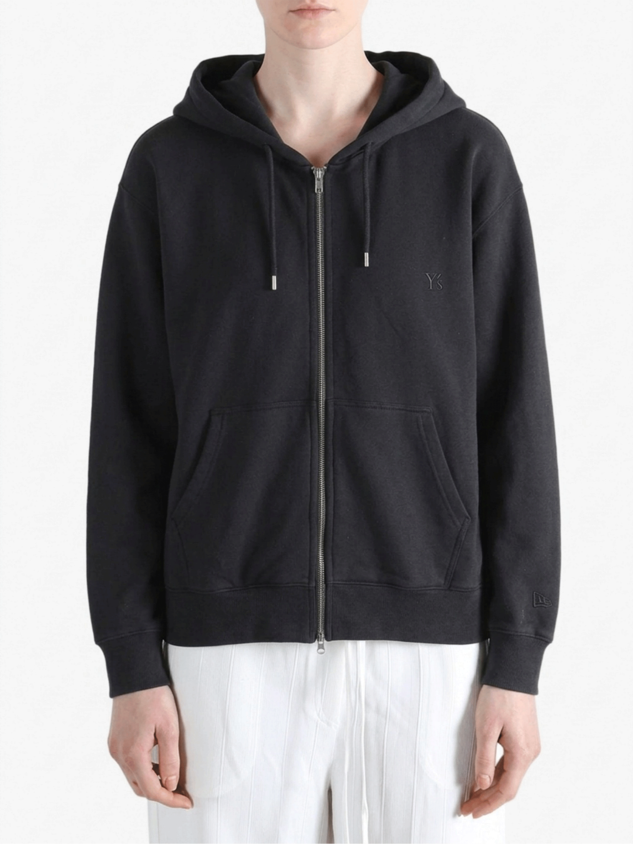Black hoodies worn by a person, showing the hoodies fit