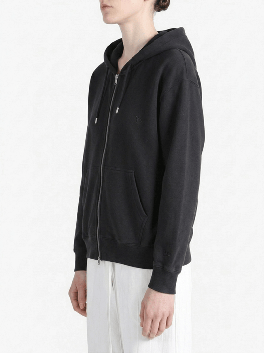 Black hoodies worn by a person, showing the hoodies fit