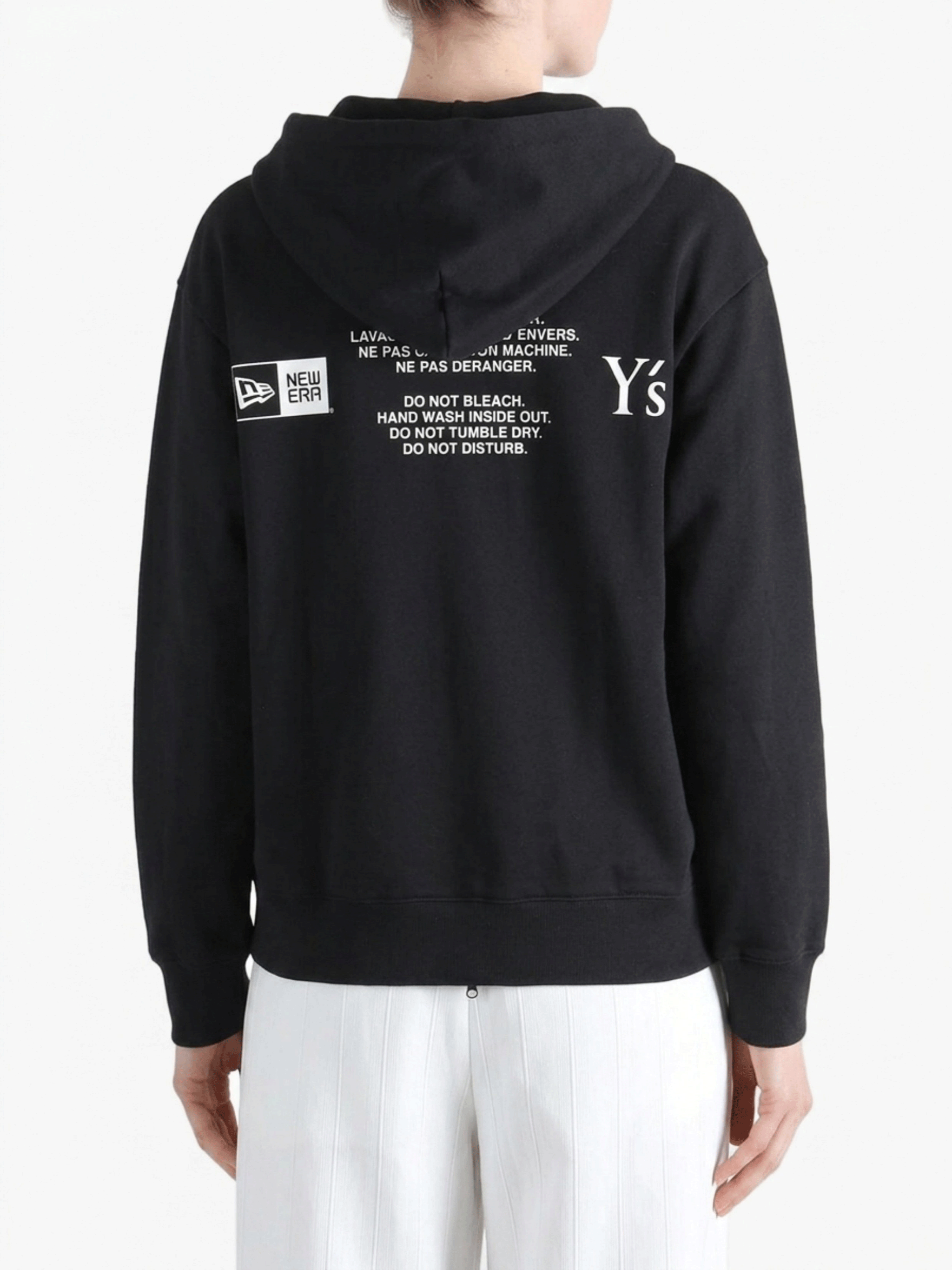 Black hoodies worn by a person, showing the hoodies fit