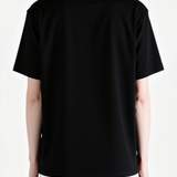 Black top worn by a person, back view