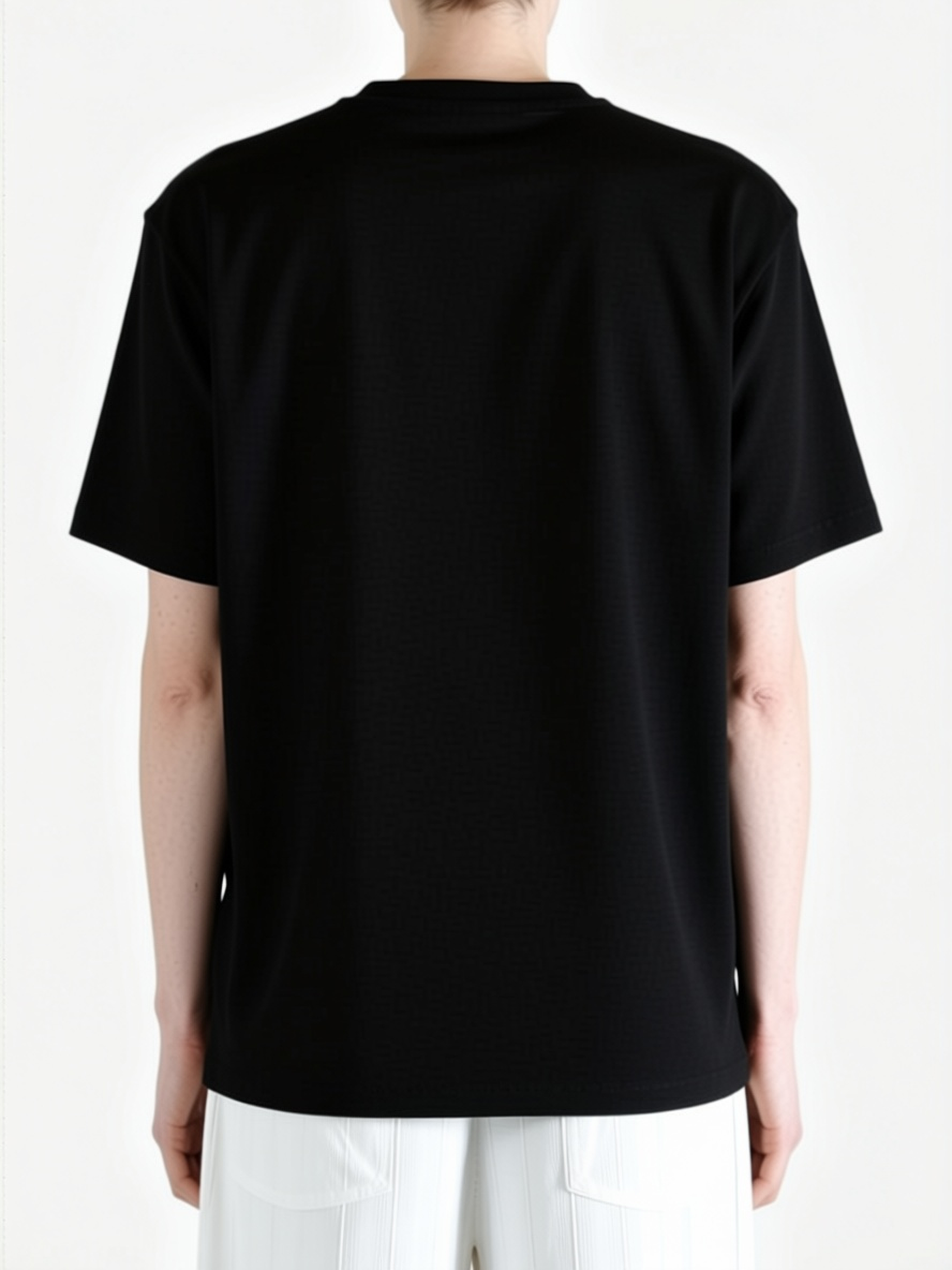 Black top worn by a person, back view