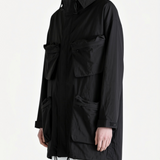 Black shirt worn by a person, side view