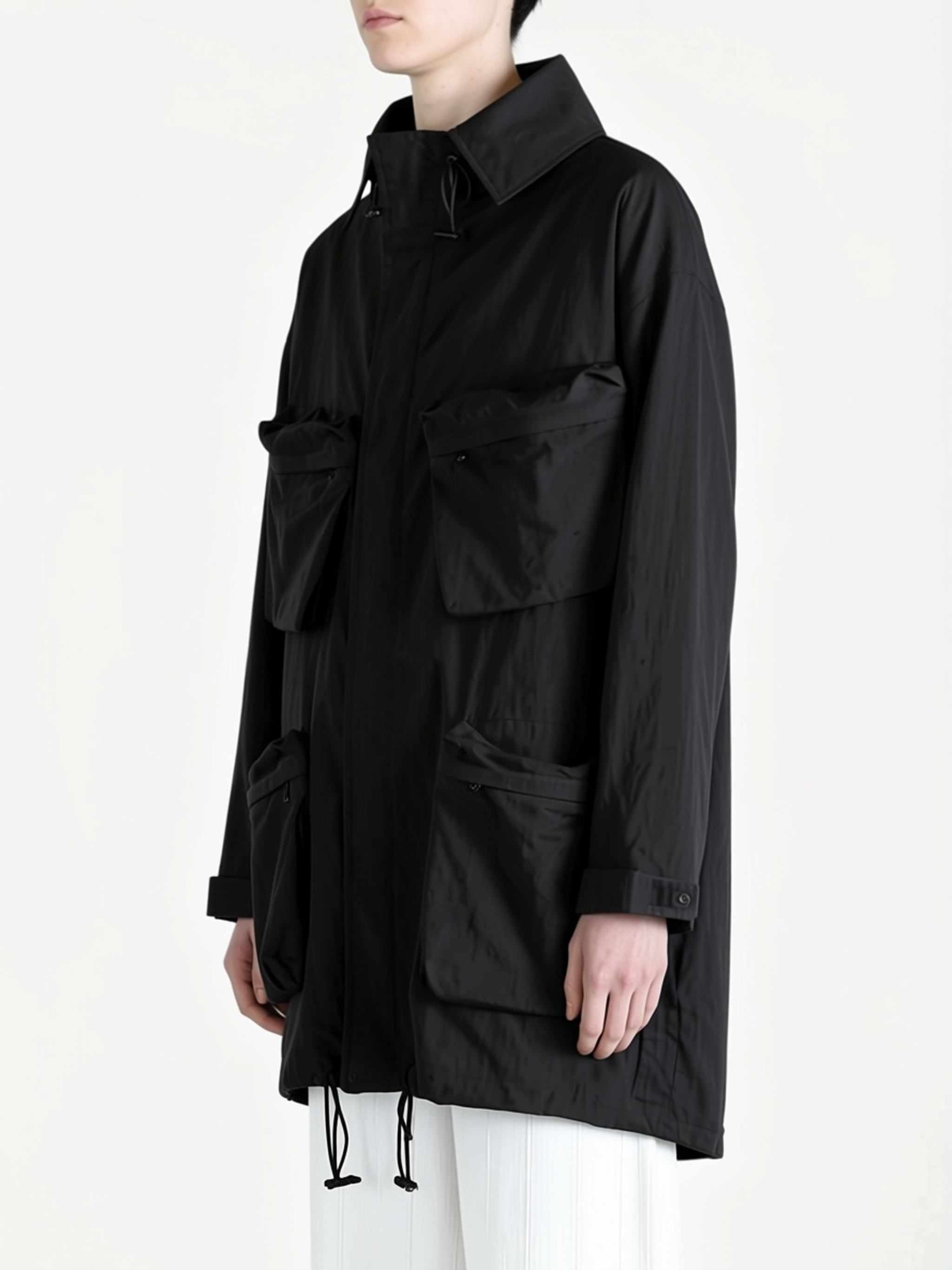 Black shirt worn by a person, side view