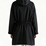 Black shirt worn by a person, back view