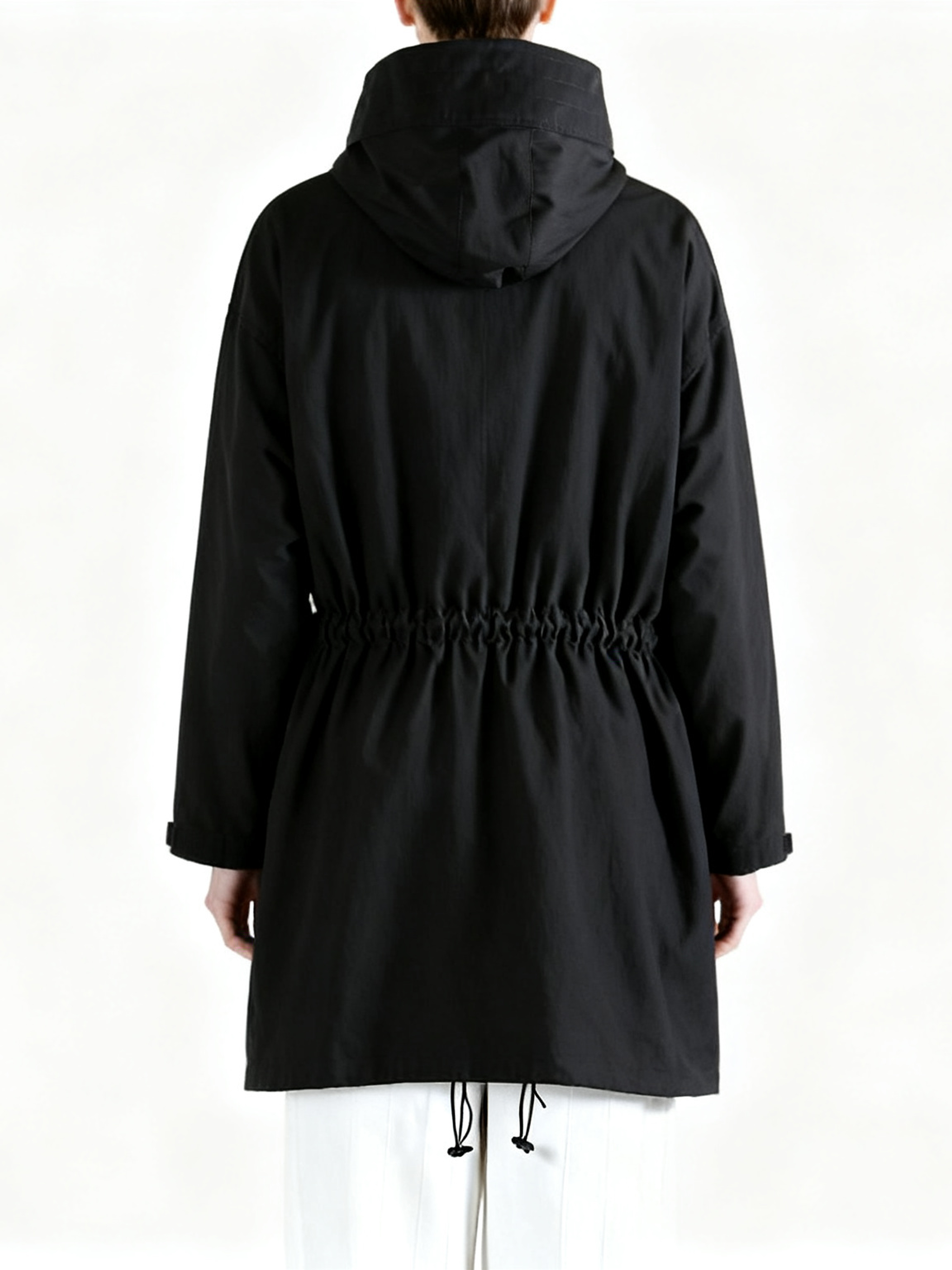 Black shirt worn by a person, back view
