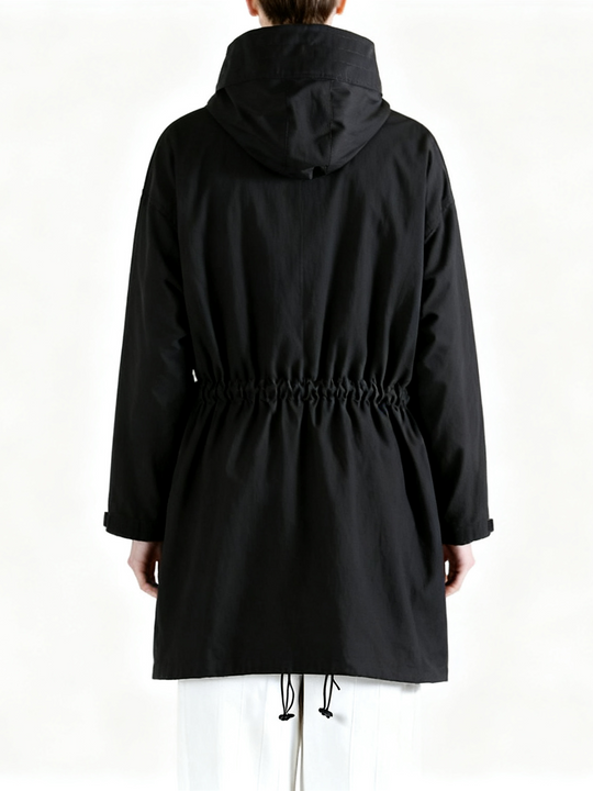 Black shirt worn by a person, back view