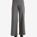 Grey pants worn by a person, showing the pants fit