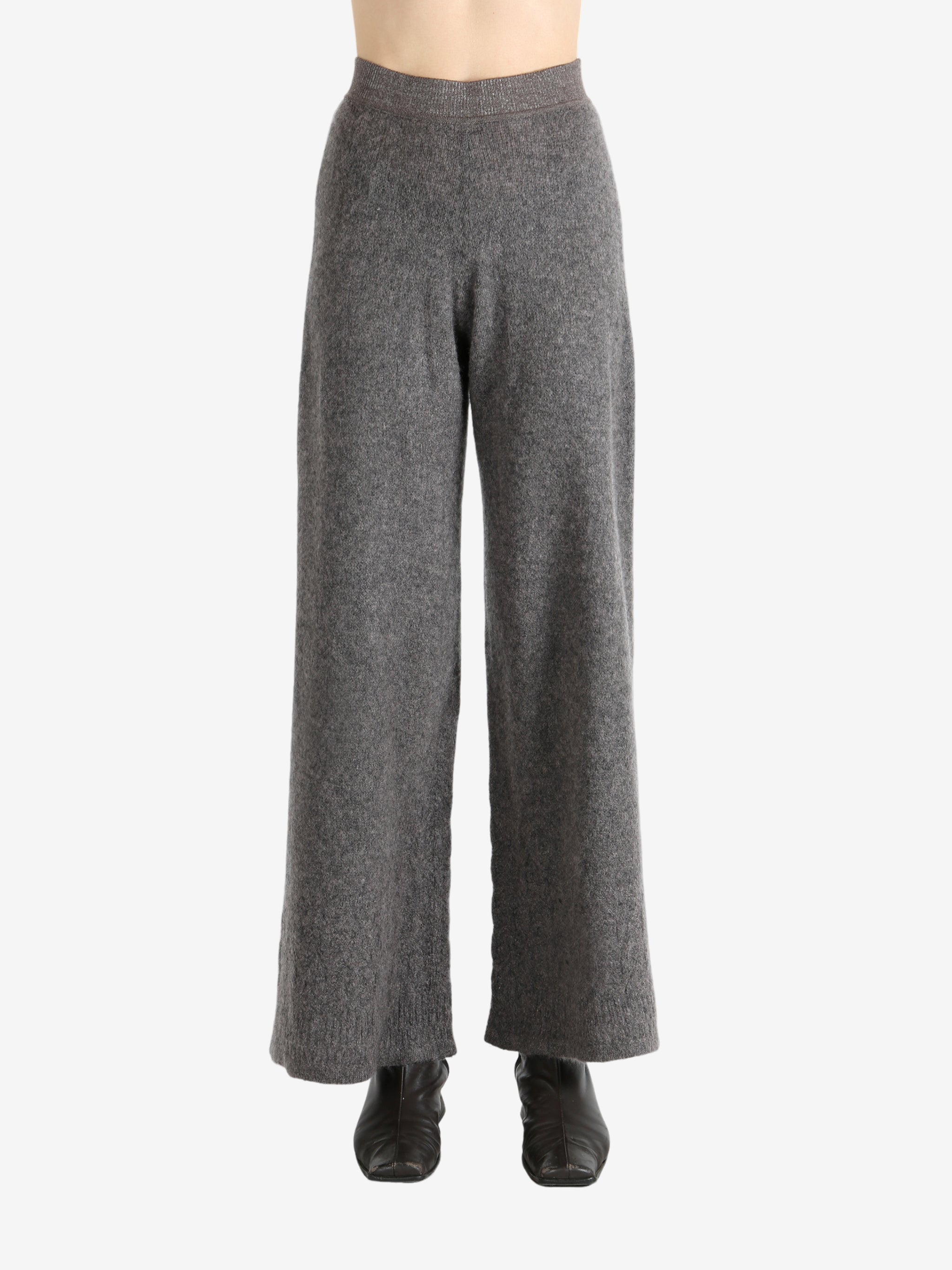 Grey pants worn by a person, showing the pants fit