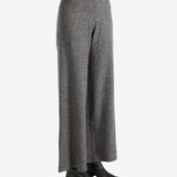 Grey pants worn by a person, showing the pants fit