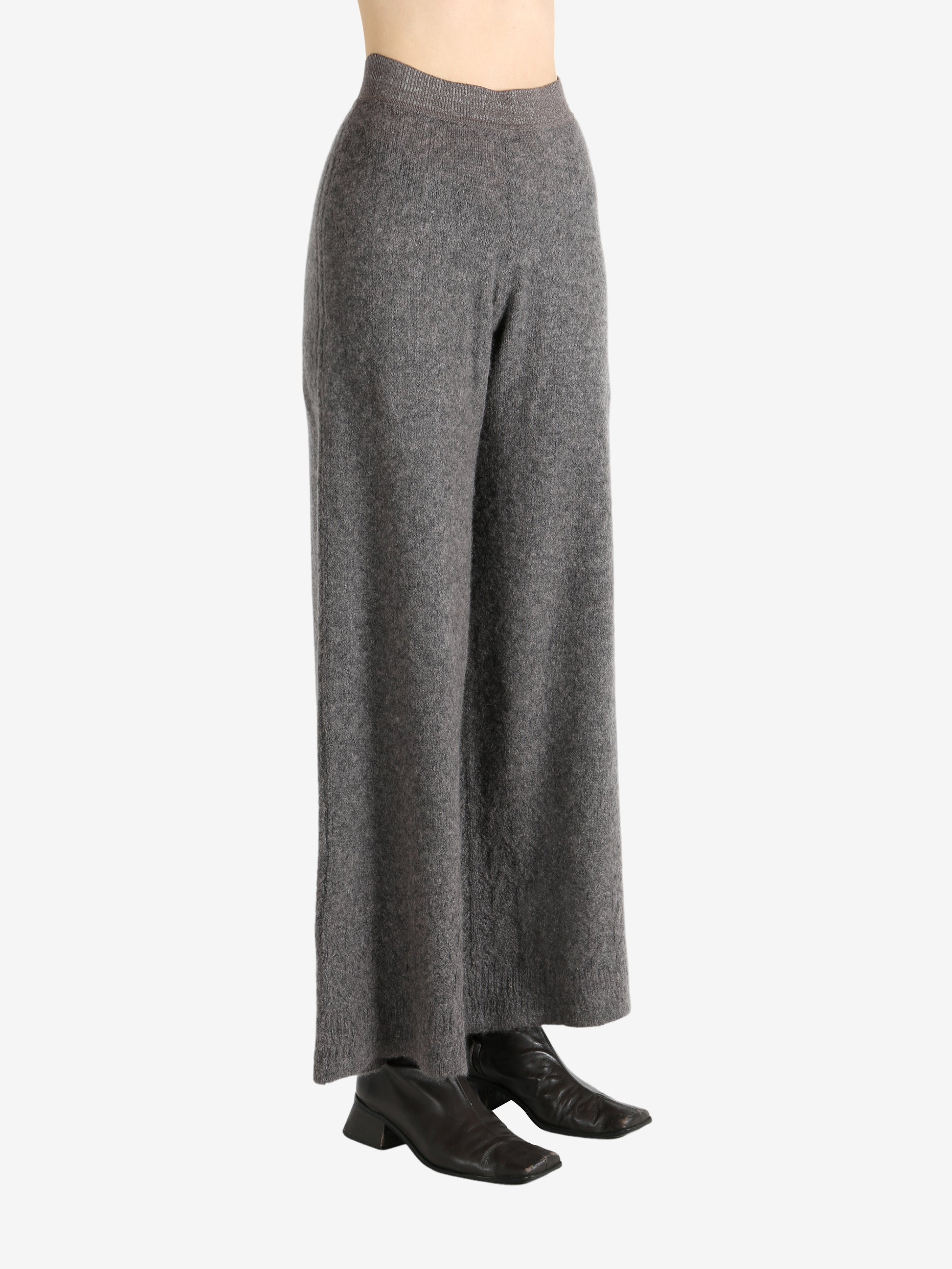 Grey pants worn by a person, showing the pants fit