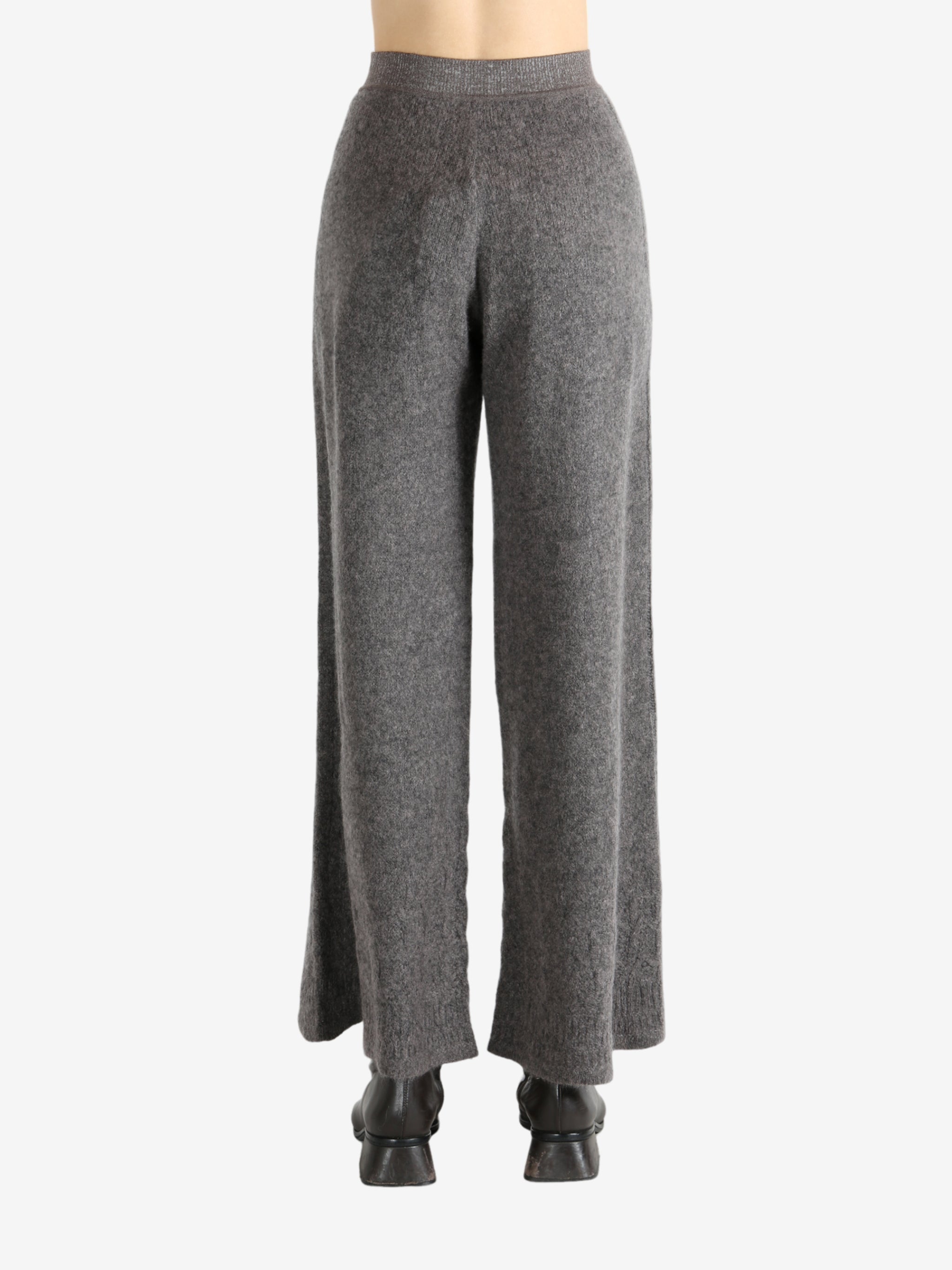 Grey pants worn by a person, showing the pants fit