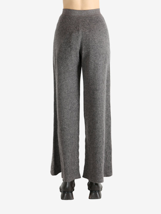 Grey pants worn by a person, showing the pants fit