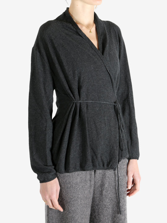 Grey tops worn by a person, showing the tops fit