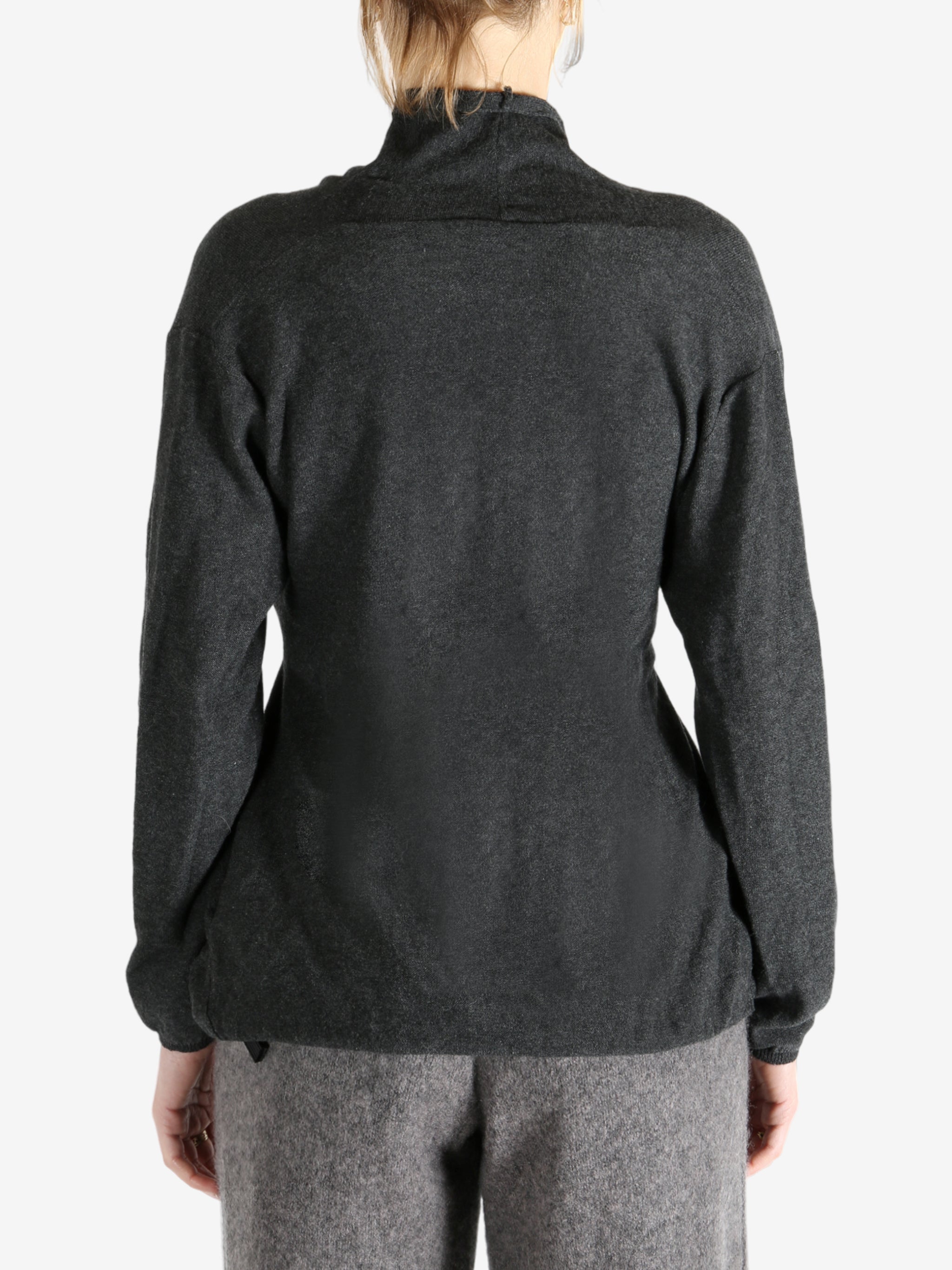 Grey tops worn by a person, showing the tops fit