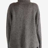 Grey top worn by a person, showing the top fit