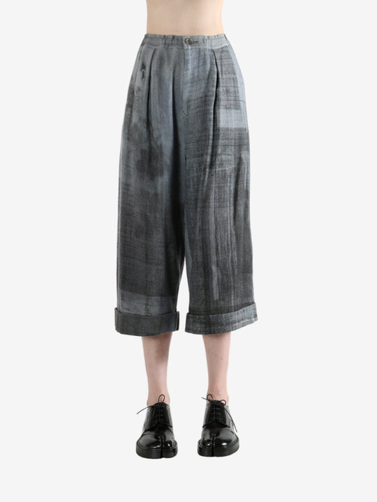 Grey pants worn by a person, showing the pants' fit