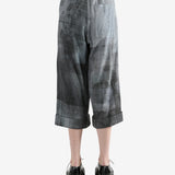 Grey pants worn by a person, showing the pants' fit