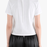 White shirts worn by a person, showing the shirts fit