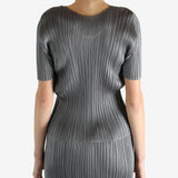 Grey shirts worn by a person, showing the shirts fit