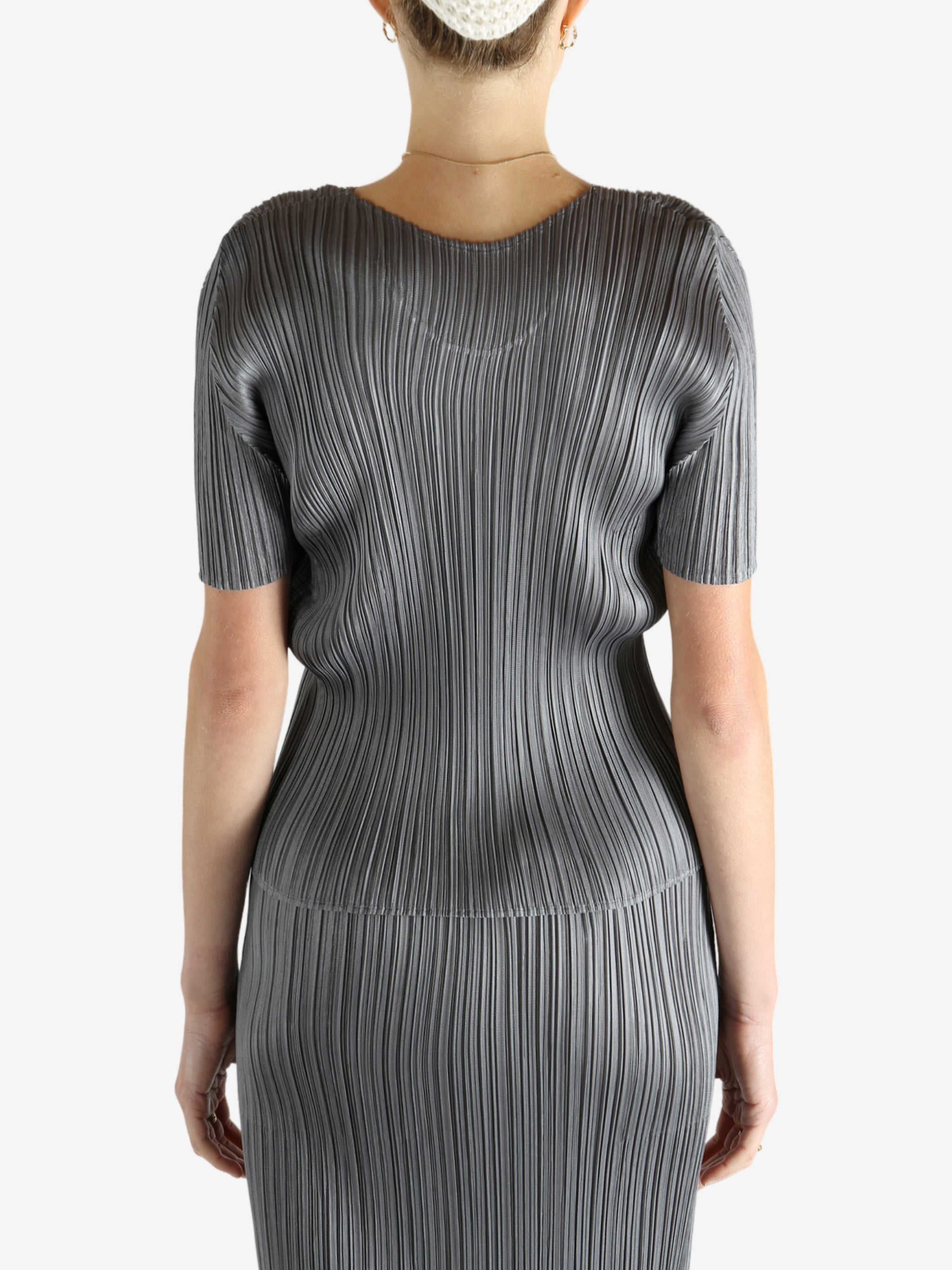 Grey shirts worn by a person, showing the shirts fit