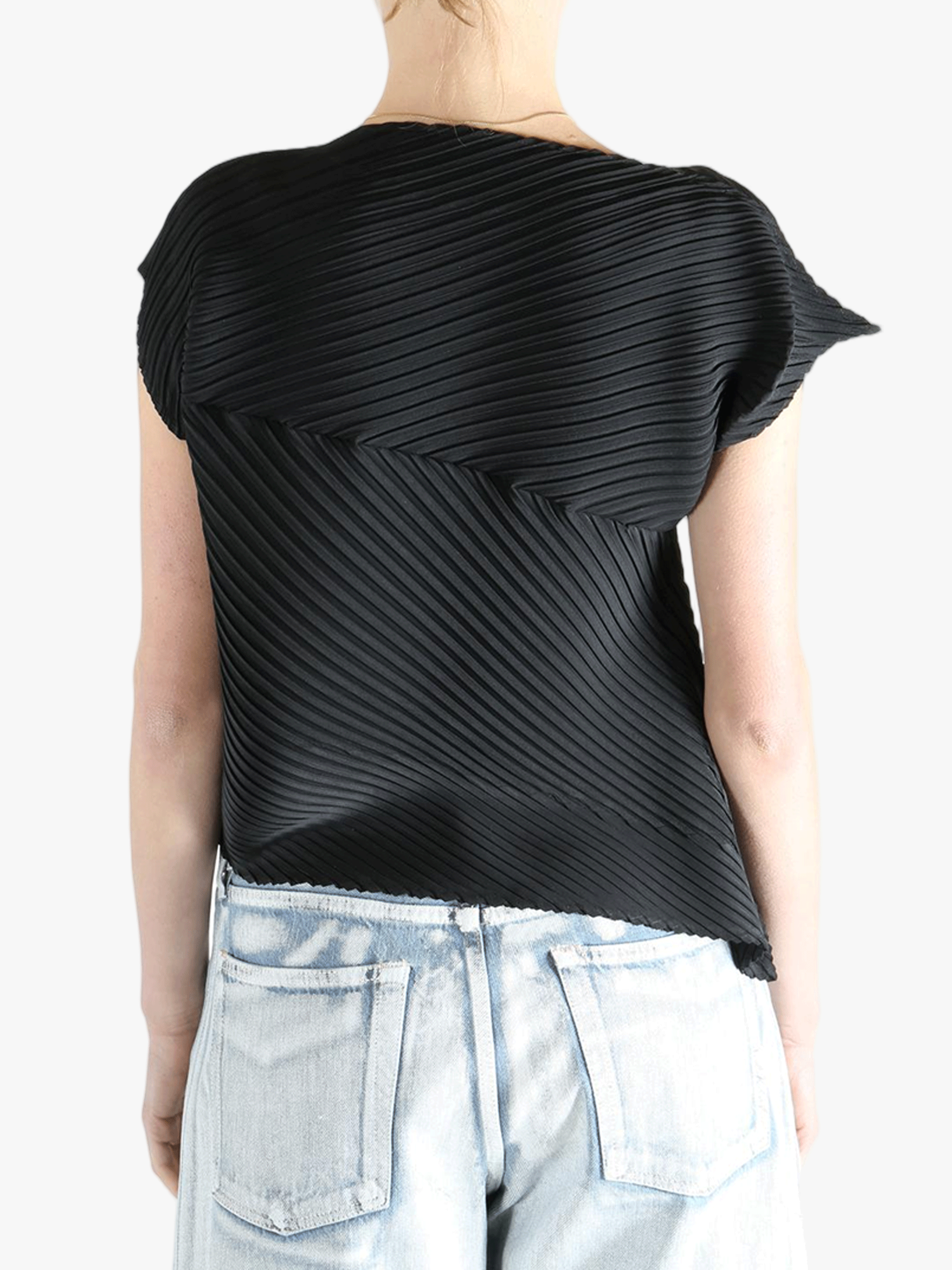 Black shirt worn by a person, showing the shirt's fit