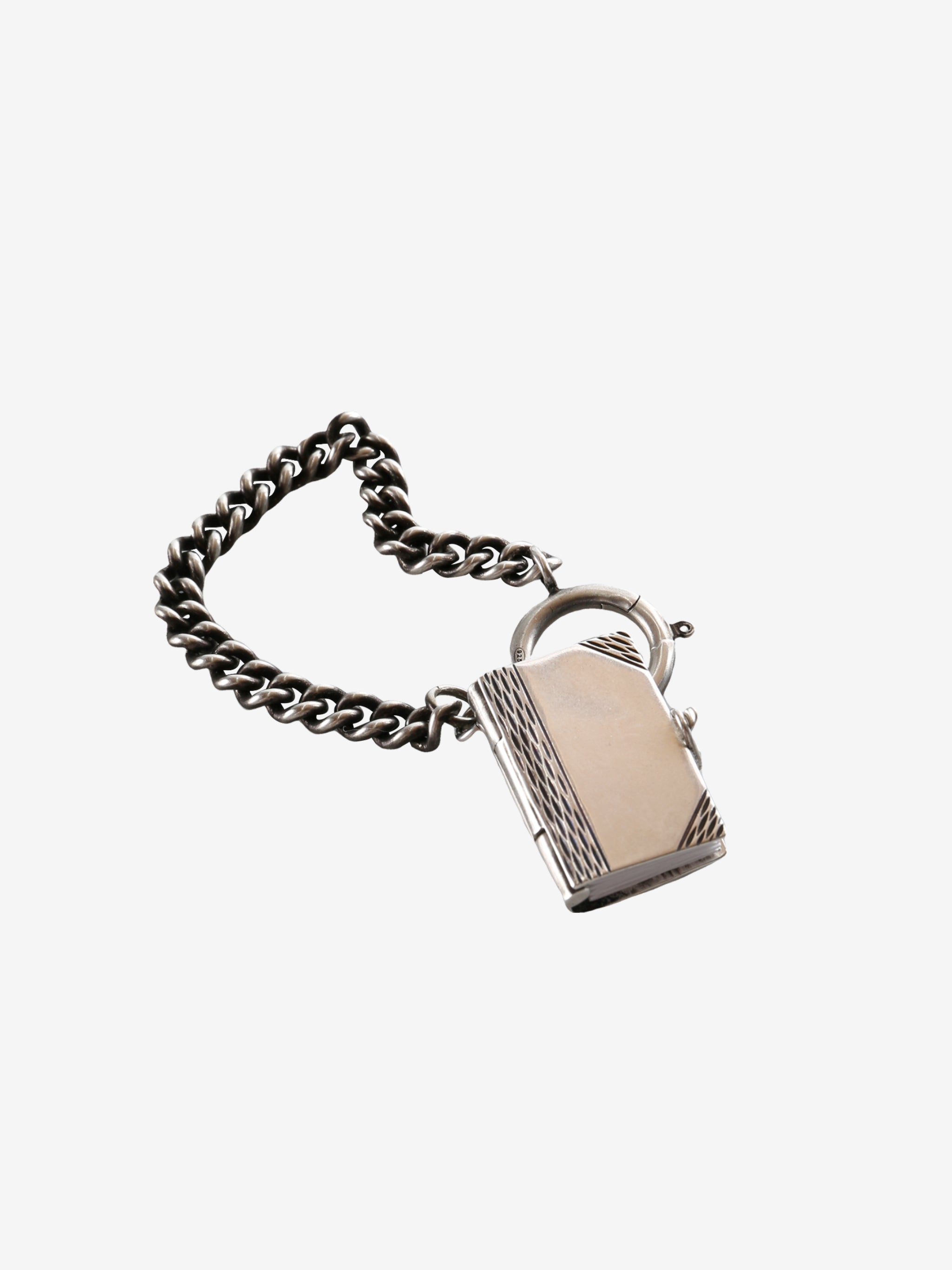 Close up of the grey charm, showing texture of the silver fabric