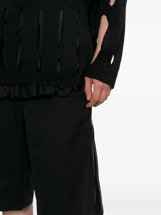 Black shorts worn by a person, showing the shorts's fit