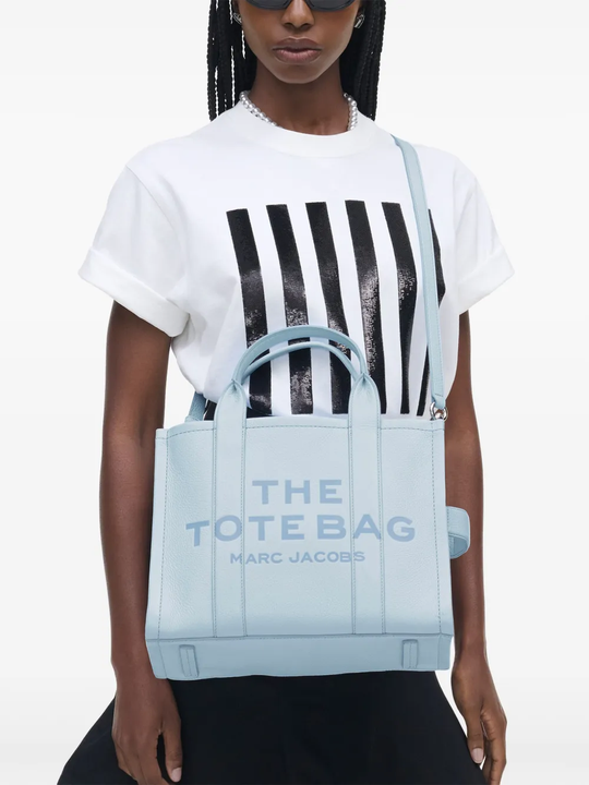 blue bags worn by a person, showing the bags fit