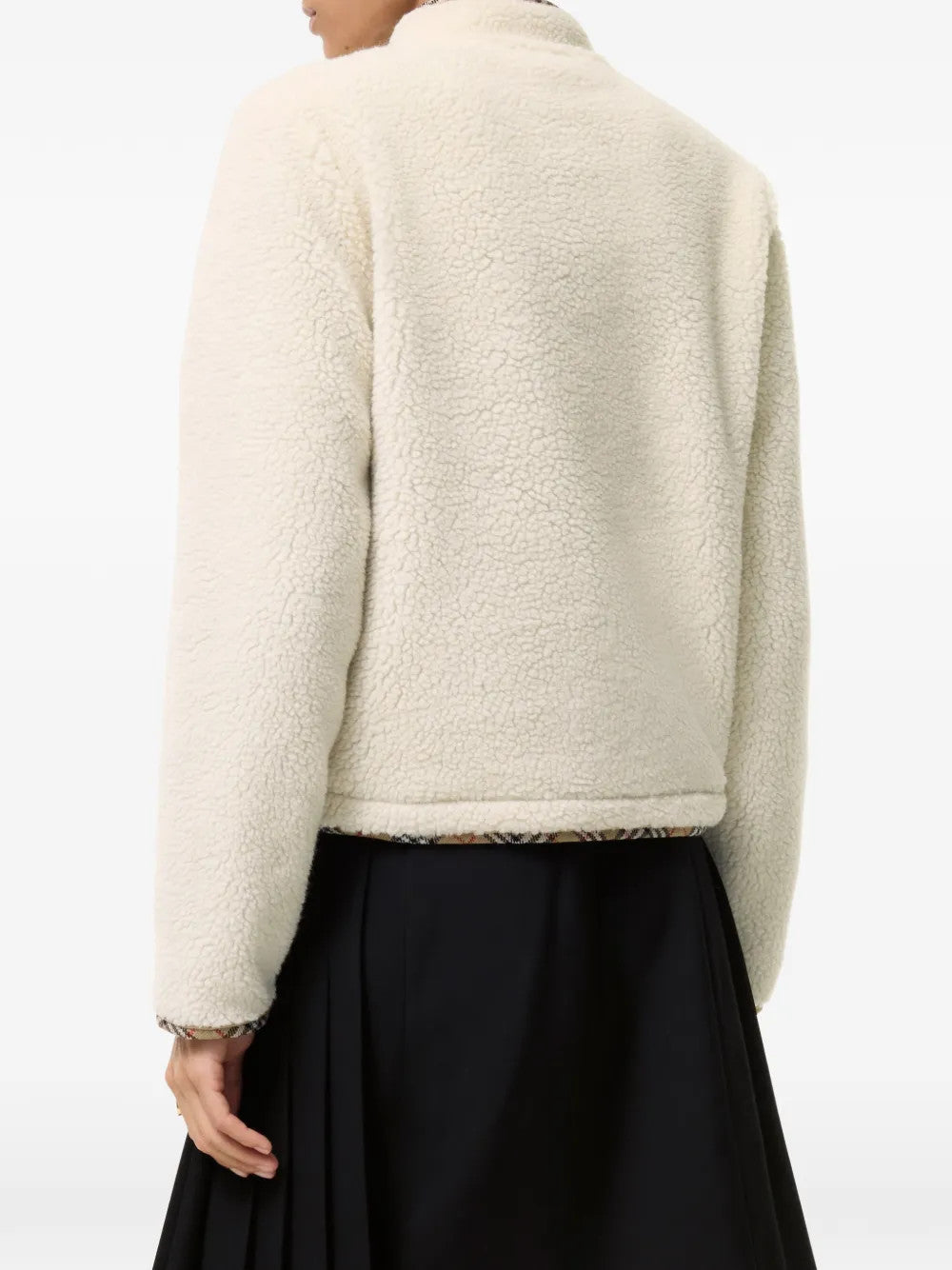 Tan jacket worn by a person, showing the jacket fit