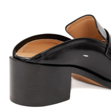 Close up of black shoes, showing texture of the leather fabric