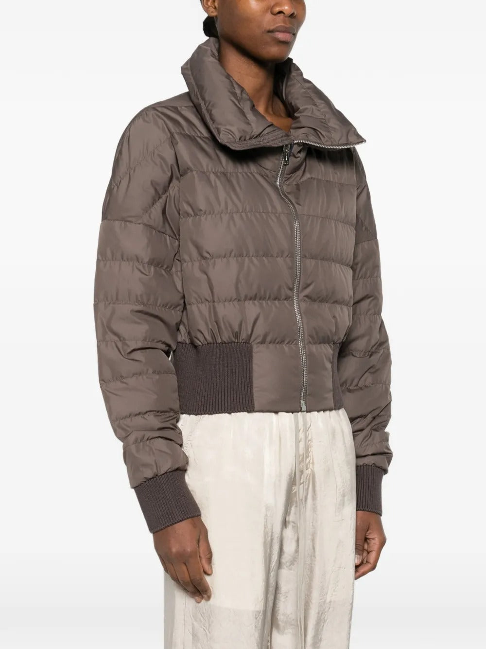 Brown jackets worn by a person, showing the jackets fit