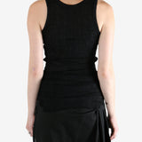 Black top worn by a person, showing the top's fit