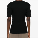 Black shirt worn by a person, showing the shirt's fit